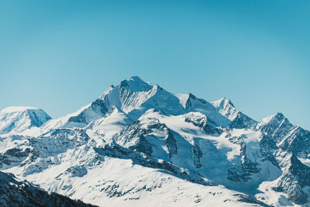 Snowy mountain top with blue sky. Caucasus Mountains, Georgia, region Gudauri.の写真素材