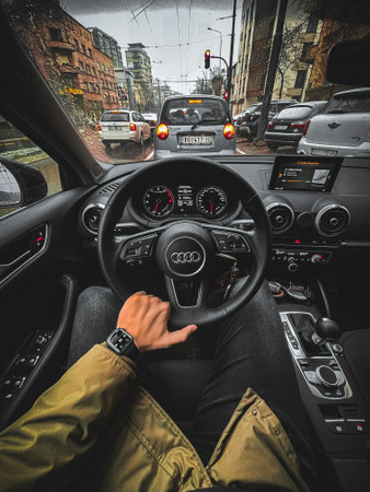 Man driving a car on a rainy day. View from inside.の写真素材