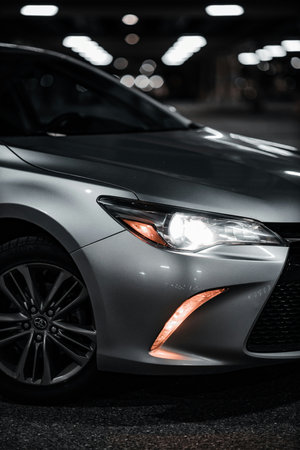 Close-up of a modern car's headlight. Selective focus.の写真素材