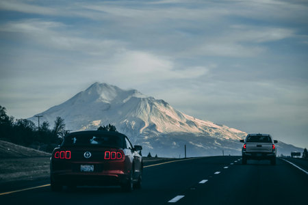 Vintage car on the road at sunset, in the evening.の写真素材