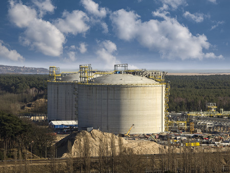 Industrial gas tanks with blue sky の写真素材