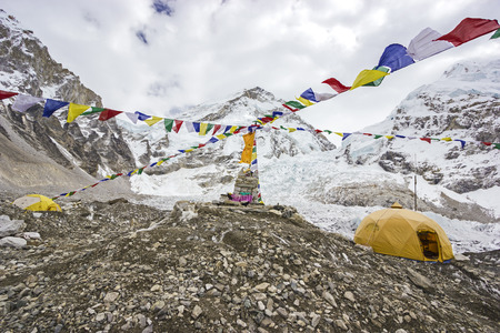 Tents in Everest Base Camp in cloudy day  Here starts the climb to reach the top of the highest mountain in the world, Everest Region, Sagarmatha National Park, Himalayas, Nepal  の写真素材