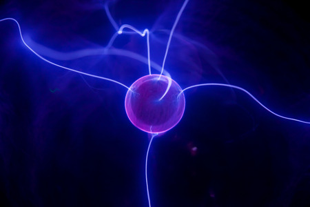 Pink plasma ball with blue blots, abstract background  の写真素材