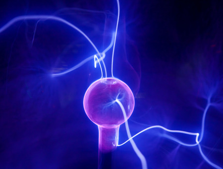 Pink plasma ball with blue blots, abstract background  の写真素材