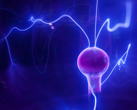 Pink plasma ball with blue blots, abstract background  の写真素材
