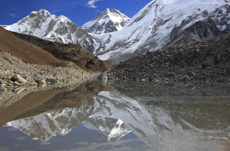 Mountains reflected in lake, Sagarmatha National Park, Himalayas の写真素材