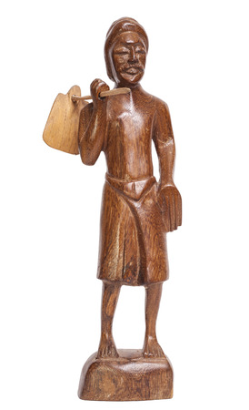Statuette of standing man with bag hanging on stick, Sri Lankaの写真素材