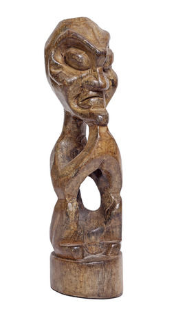 Traditional statuette from Indonesia, isolated on whiteの写真素材