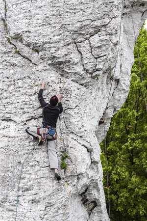  Man climbing wall.の写真素材