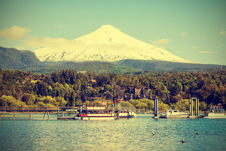 Snow covered Volcano Villarica, Chile, vintage retro style  の写真素材