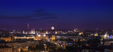 Full moon over city, Prague at night, Czech republic の写真素材
