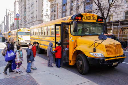 New York City, USA - March 03, 2011  Children entering school bus in the center of Vew Your City のeditorial素材
