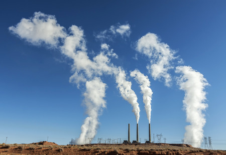 Power industry infrastructure  Chimney white smoke on a blue sky, USA の写真素材