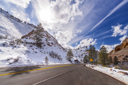 Sun above a mountain road in Zion National Park, Utah, USA  の写真素材