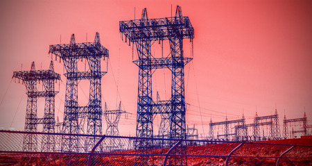 Futuristic industrial vision, pylons and transmission power lines.の写真素材