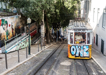 Lisbon, Portugal - September 19, 2014: Tram, the symbol of the city in narrow street of Lisbon.のeditorial素材