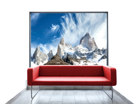 Empty room with red sofa and mountain view through window.の写真素材