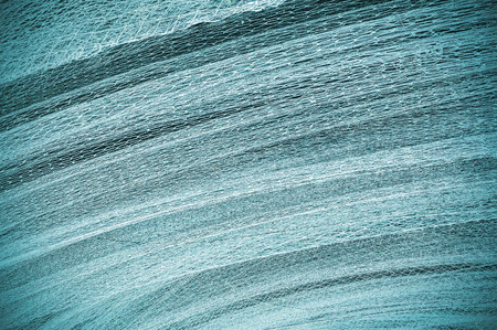Abstract background made of a fishing net.の写真素材