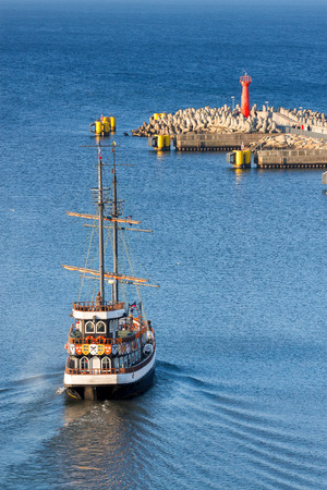 Historic sailing ship leaving port of Kolobrzeg, Poland.の写真素材