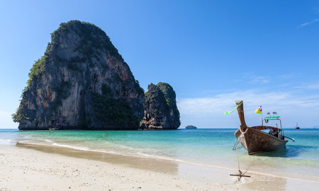 Wooden boat on the tropical beach Railay in Thailand.の写真素材