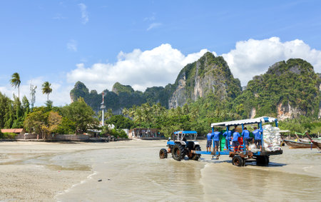 Railay, Thailand - December 31, 2014: Food and staff transport from mainland by boats to Railay beach, one of the most popular rock climbing locations in Asia.のeditorial素材