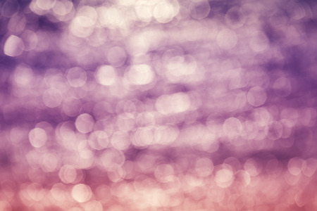 Abstract background made of water reflection bokeh circles.