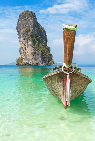 Old wooden boat on a tropical island.の写真素材