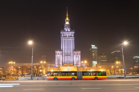 Warsaw, Poland - February 28, 2015: Public bus in front of Palace of Culture and Science, symbolic landmark in Warsaw.のeditorial素材
