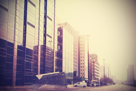 Vintage retro filtered picture of modern downtown in Warsaw, Poland.の写真素材