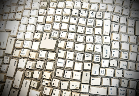 Grungy abstract background made of computer keyboard keys.の写真素材