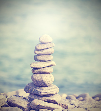Retro filtered heap of stones, Zen spa concept background.の写真素材