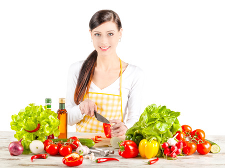 Young woman preparing salad. Healthy food and diet concept. Isolated on white.の写真素材