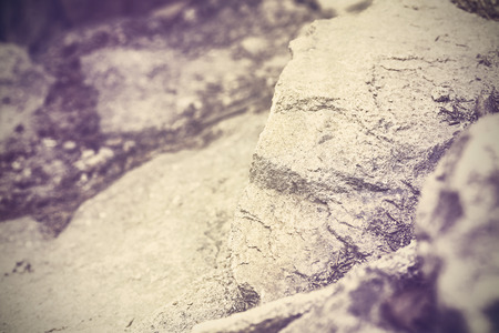 Vintage toned nature abstract background made of rocks, shallow depth of field.の写真素材