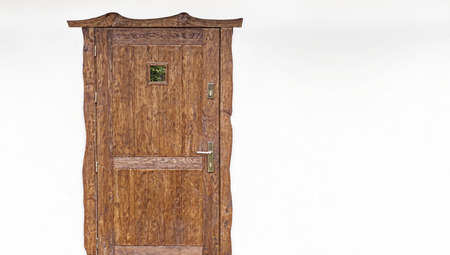 Wooden door on the white house facade, space for text.の写真素材
