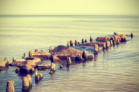 Retro vintage style photo of a beach, nature peaceful background.の写真素材