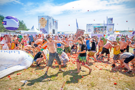 Kostrzyn nad Odra, Poland - August 1, 2015: Tomato fight on the 21th Woodstock Festival Poland (Przystanek Woodstock), one of the biggest ticket free rock music festivals in Europe.のeditorial素材