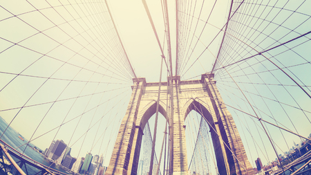 Retro stylized photo of Brooklyn Bridge, fisheye lens, NYC, USA.の写真素材