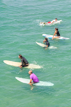 Venice, Los Angeles, USA - August 22, 2015: Surfers waiting for waves on a beautiful sunny day.のeditorial素材
