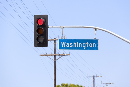 Washington avenue street sign and traffic lights in Venice, California, USA.の写真素材