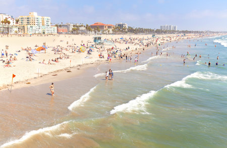 Santa Monica, USA - August 22, 2015: People resting on beach during peak season. Santa Monica had become famous resort town by the early 20th century.のeditorial素材