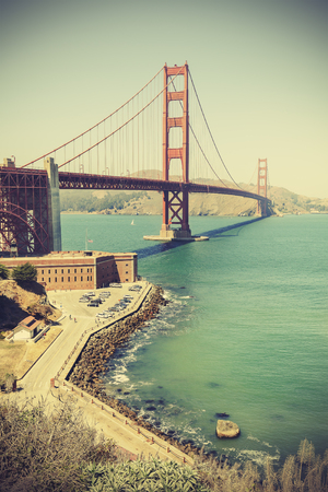 Old film retro style Golden Gate Bridge in San Francisco, vignette effect, USA.の写真素材