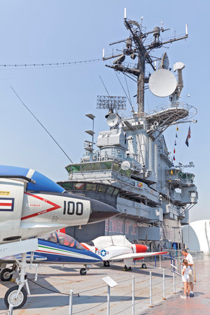 New York, USA - August 17, 2015: People visiting Intrepid Sea, Air and Space Museum in New York. Museum was founded in 1982 onboard the USS Intrepid, retired aircraft carrier.のeditorial素材