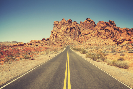 Retro stylized road through rocky desert in Valley of Fire State Park, Nevada.の写真素材