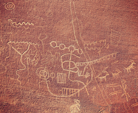 Ancient petroglyphs on rock in Valley of Fire State Park, Nevada, USA.の写真素材