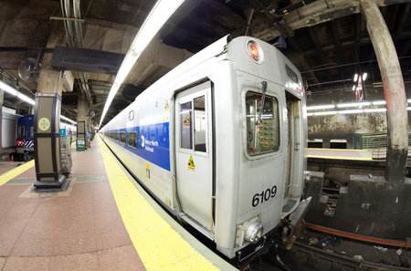 New York, USA - August 15, 2015: Fisheye lens photo of MTA train at the Grand Central Terminal. The MTA is North America's largest transportation network with 8856 rail and subway cars.のeditorial素材