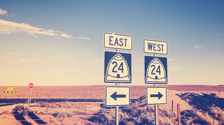 Vintage cross processed photo of road signs, choice concept.の写真素材