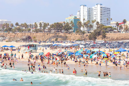 Santa Monica, USA - August 22, 2015: Beach full of people during peak season. Santa Monica had become famous resort town by the early 20th century.のeditorial素材