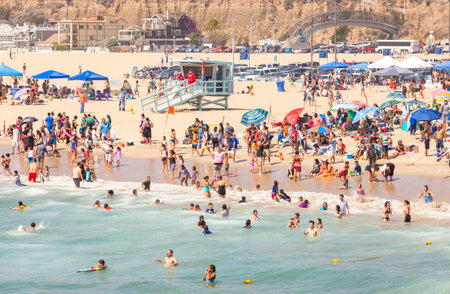 Santa Monica, USA - August 22, 2015: Beach full of people during peak season. Santa Monica had become famous resort town by the early 20th century.のeditorial素材