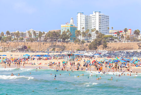 Santa Monica, USA - August 22, 2015: Beach full of people during peak season. Santa Monica had become famous resort town by the early 20th century.のeditorial素材