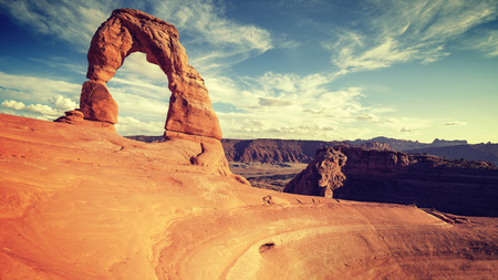 Vintage toned Delicate Arch at sunset, Utah, USA.